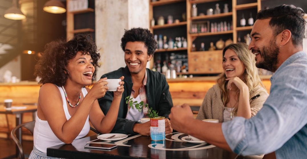 Friends laughing at french love idioms