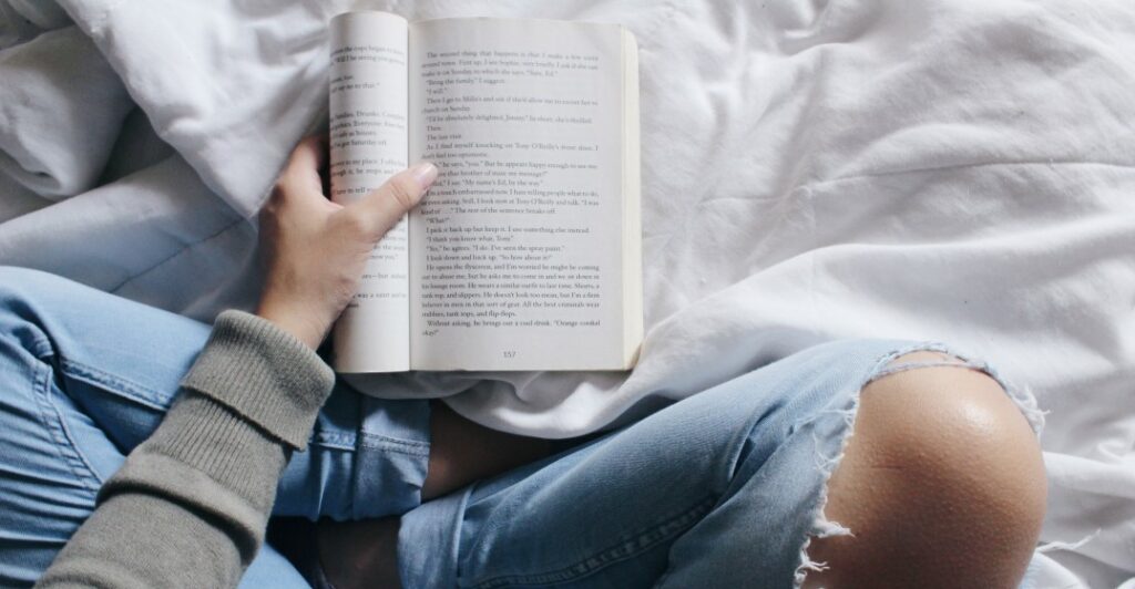 woman reading the best fiction books in english