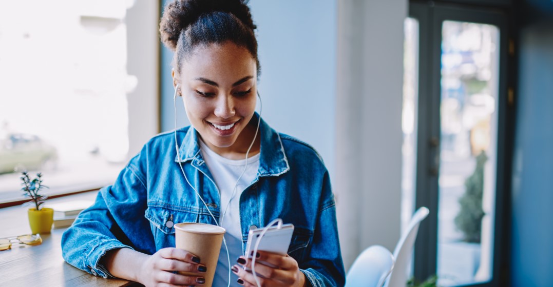 woman listening to spanish langiage learning podcasts for beginners