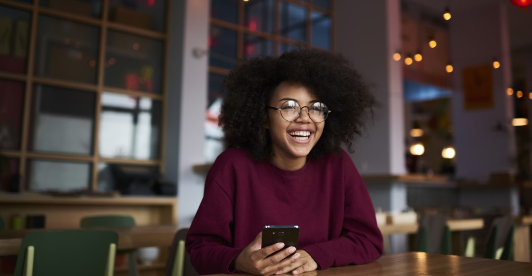 woman looking up on her phone the biggest differences between America and German culture