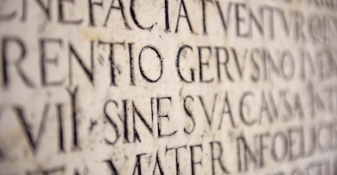 a stone with some latin, a dead language, inscriptions