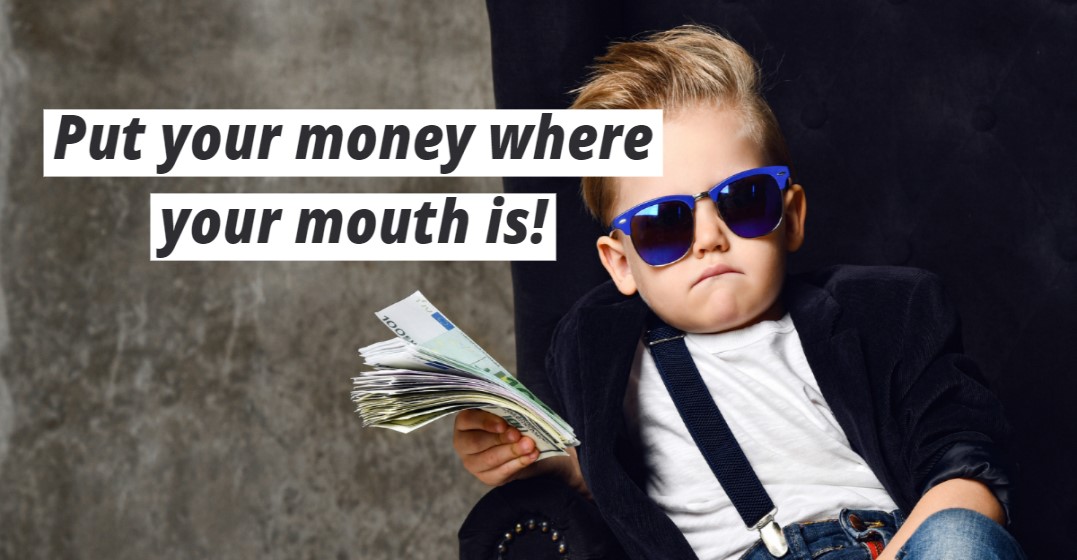 A small kid with bills in his hands representing money expressions in English