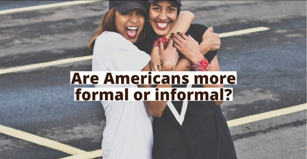 Two young women hugging as part of the informality in American culture