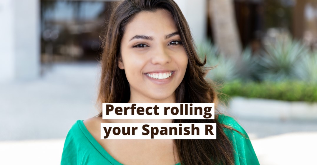 A smiling woman learning hot to roll the r in Spanish