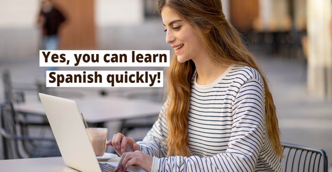 Young student at a laptop researching if she can learn Spanish in 3 months