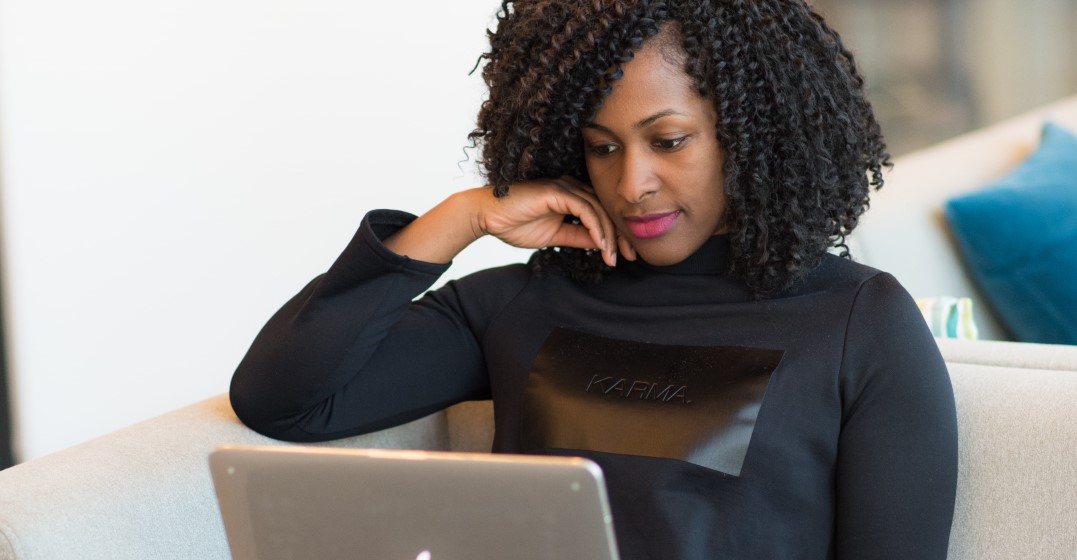 Woman at a laptop looking up the best online German classes