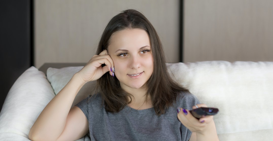 Young woman watching American series on Netflix