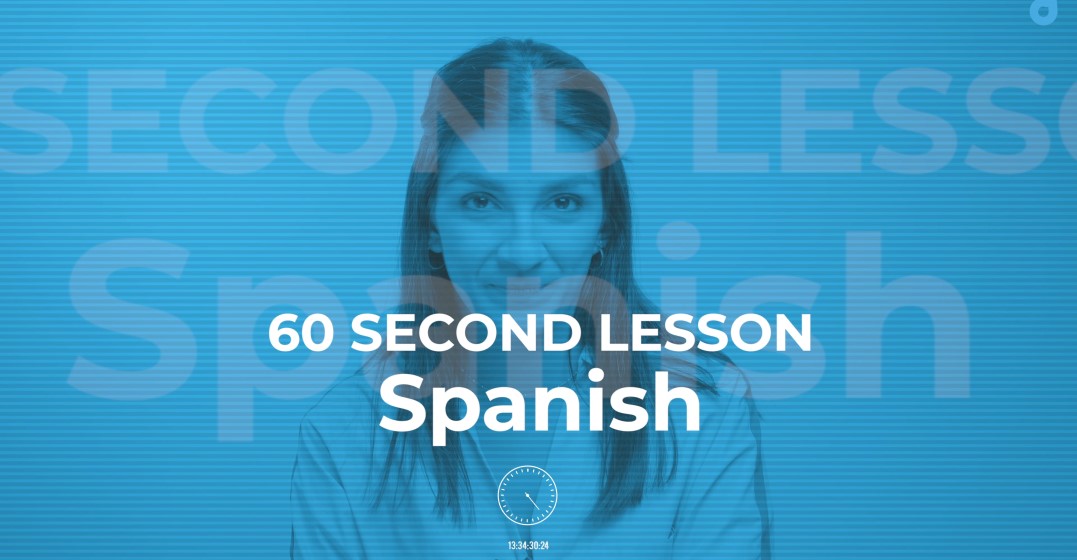 Smiling woman teaching how to say I am in Spanish