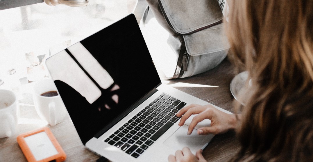 woman learning a langiage online using modern technology