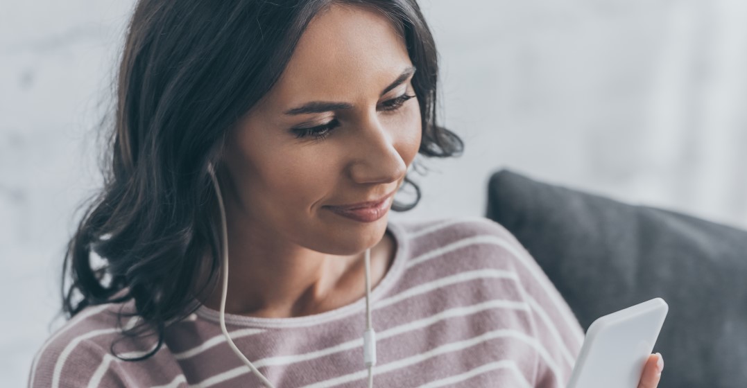 woman listening to the The most spoken words in English on her phone