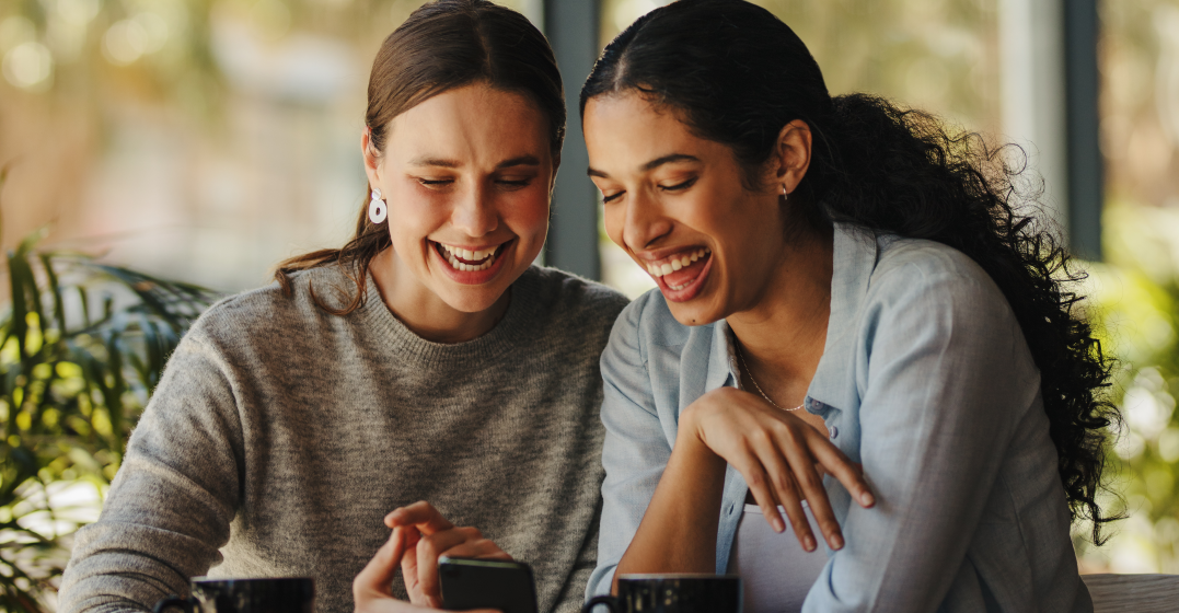 women looking up beautiful German words and phrases