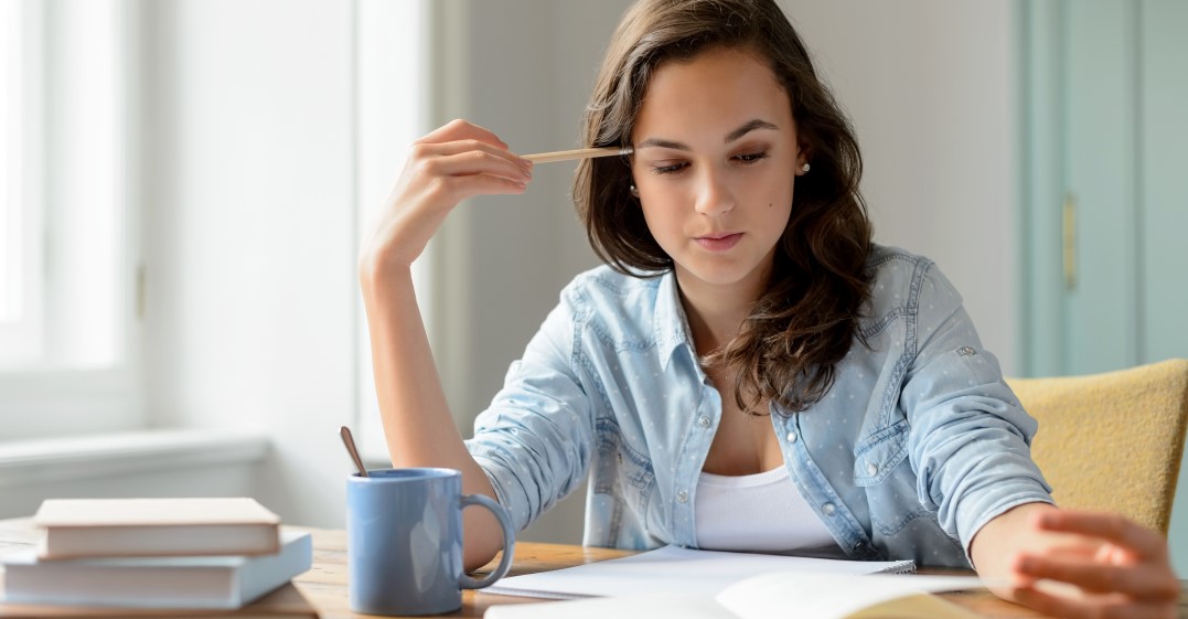 a woman studying How to remember articles in German