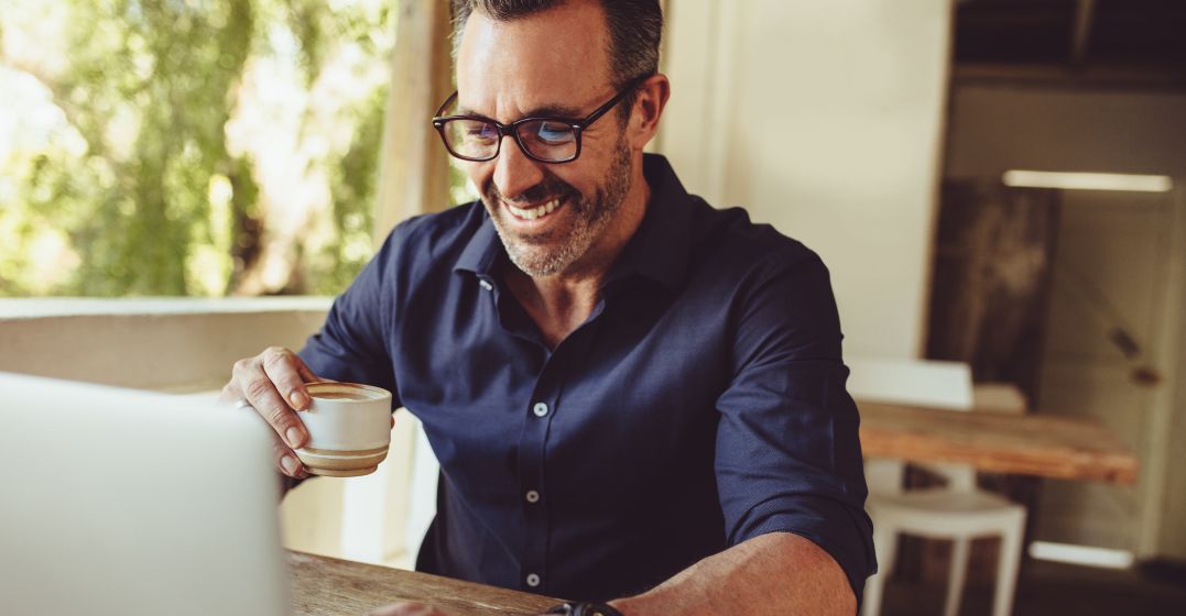 man on laptop thinking about when to use When to use May or Might in English
