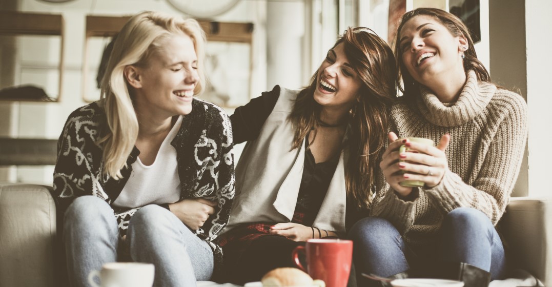 friends laughing together about English slang words