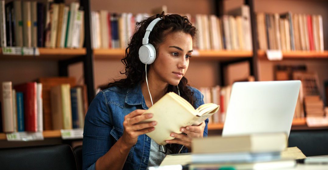 Young woman learning Spanish on her own