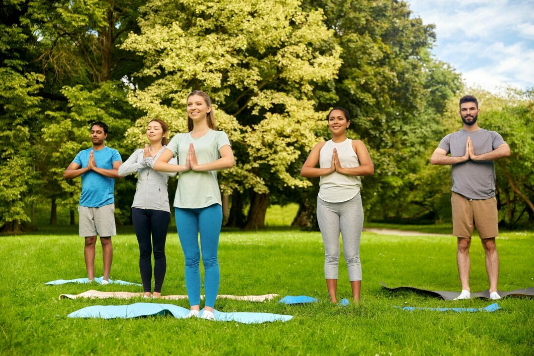 German body parts: women in a park doing yoga