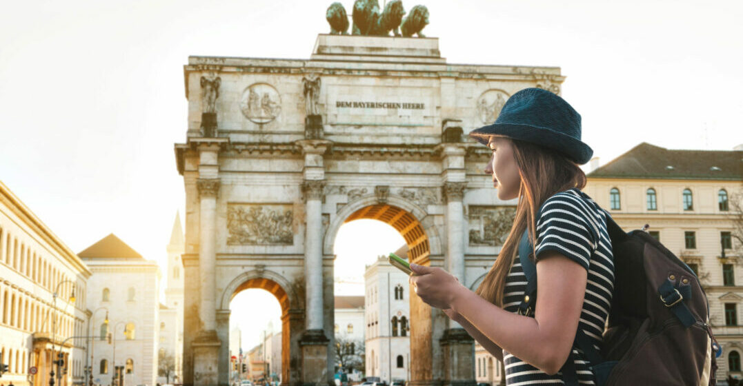 Why learn German? Tourist girl looking at Brandenburger Tor