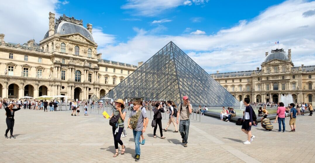 People visiting the Louvre museum's best paintings