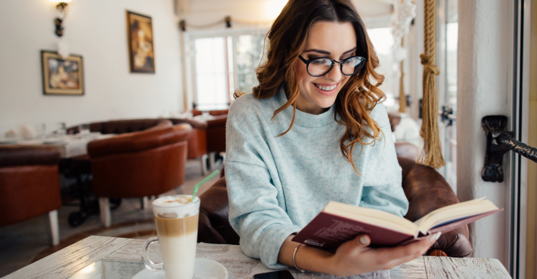 a woman reading german books for beginners