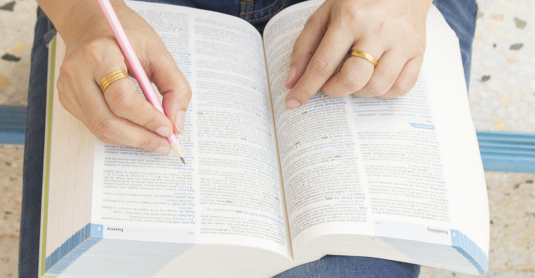 A woman looking up the word of the year