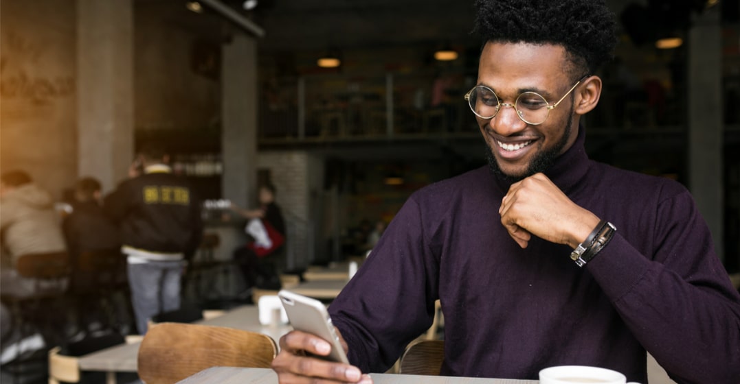 man looking up the hardest word to pronounce