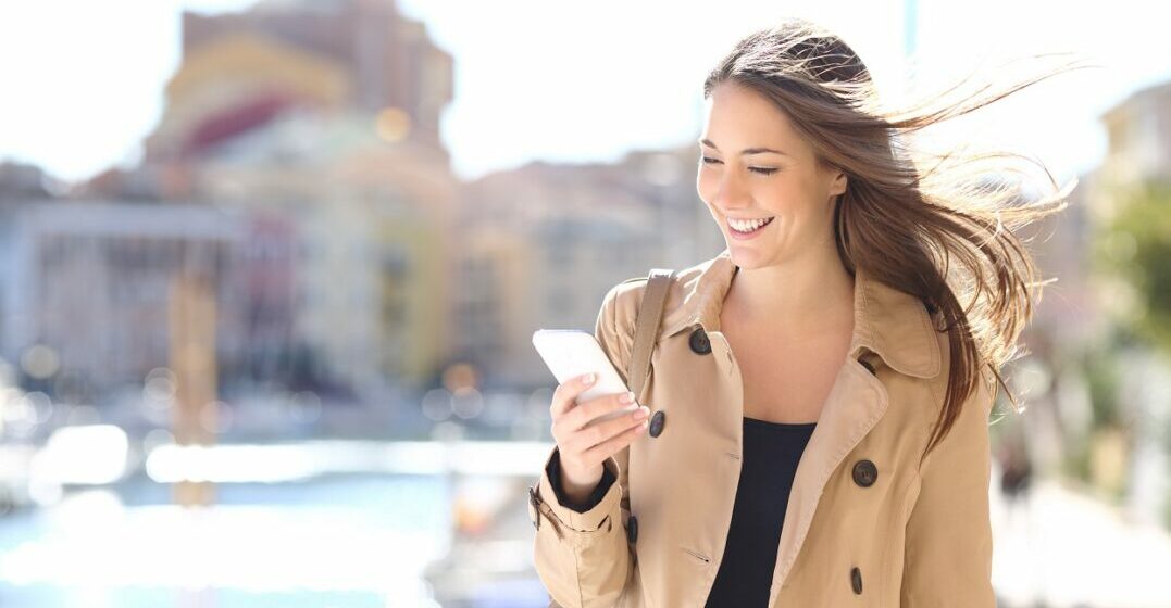 Young woman writing messages with social media slang terms