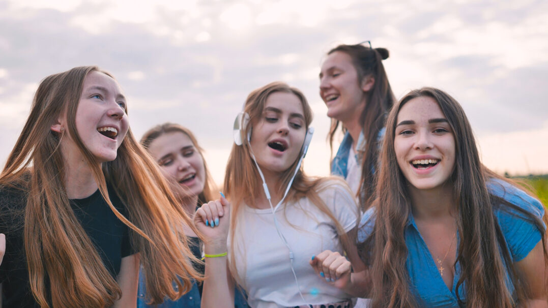 Girls listening to music and learning music vocabulary
