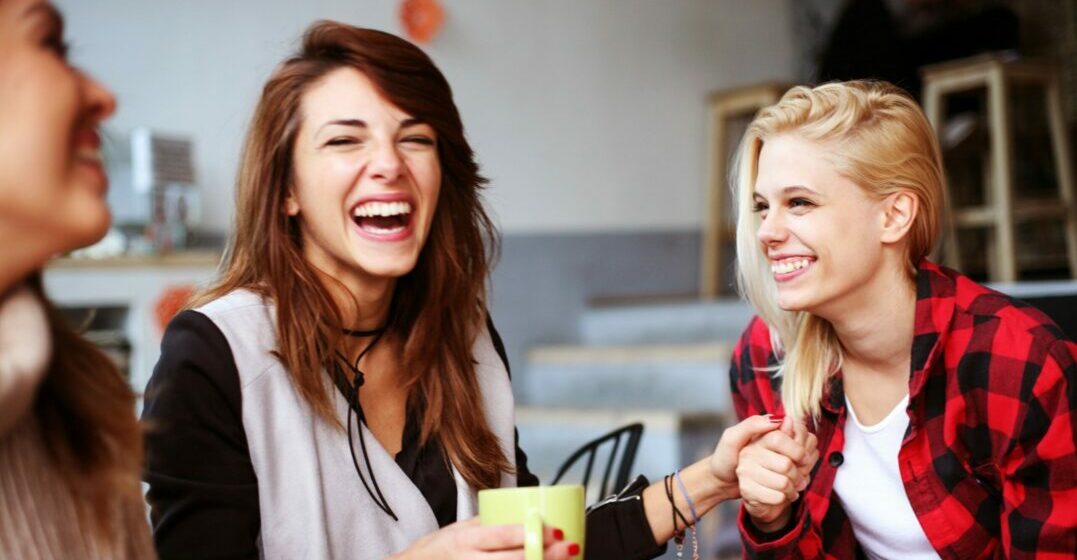 Friends laughing about old English words