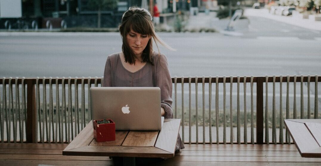Young woman learning how to use neither or either