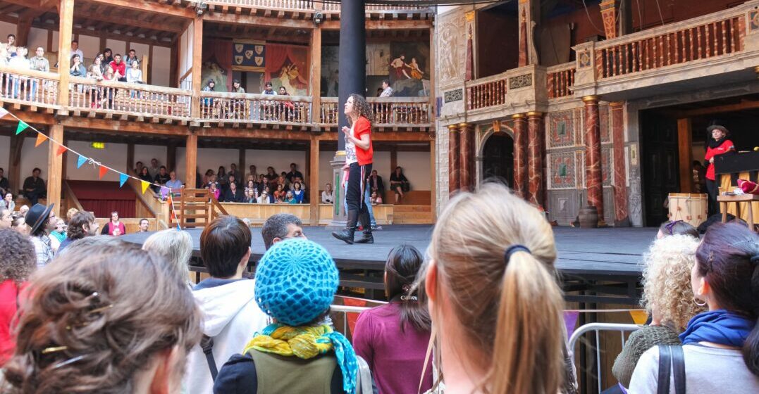 A play in the globe theatre with an actor reciting Shakespeare idioms
