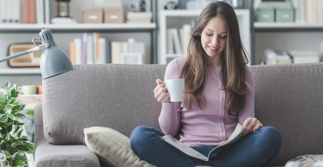 Young girl learning French with French magazines