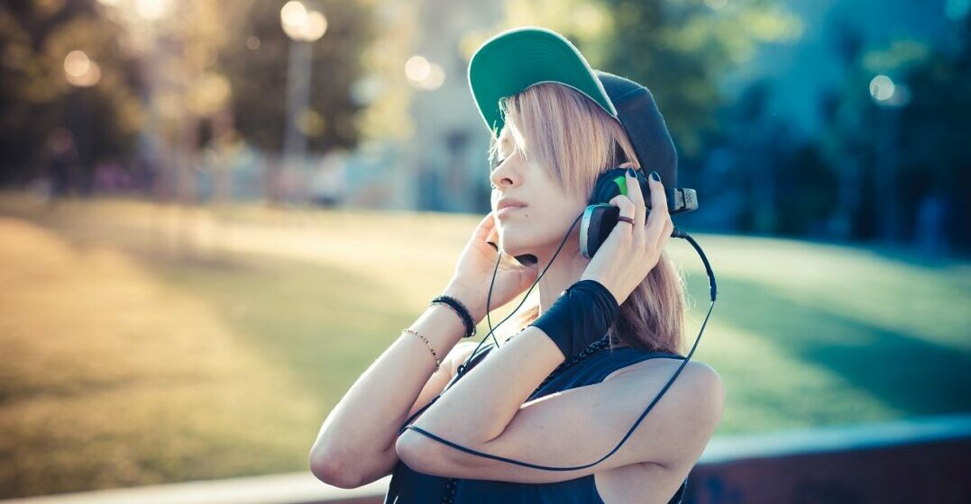 Young woman listening to German rap