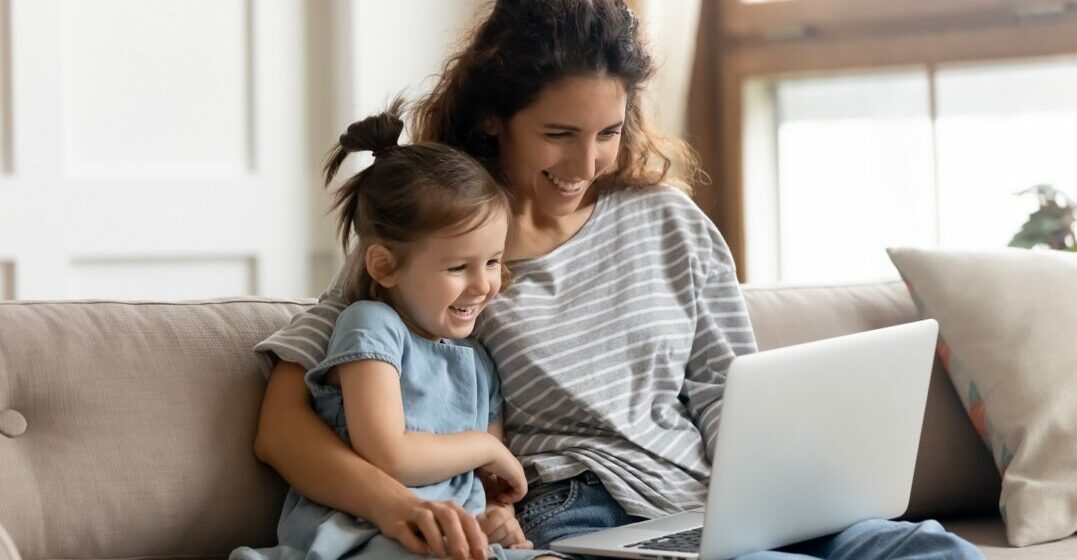Mother and daughter watching French cartoons
