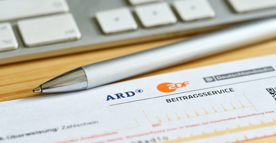 An official letter by GEZ to show the German TV tax and a pen