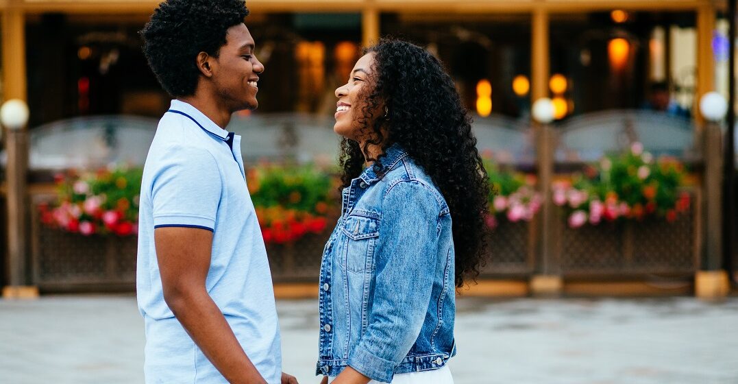 African American couple looking at each other saying words of endearment