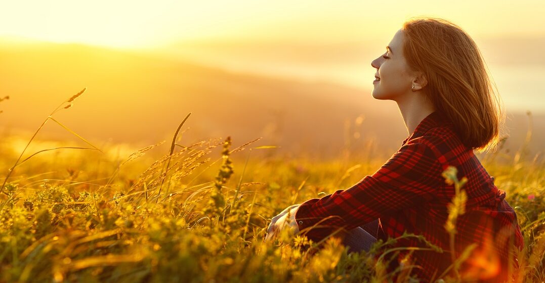 Young woman thinking about inspirational words in other languages