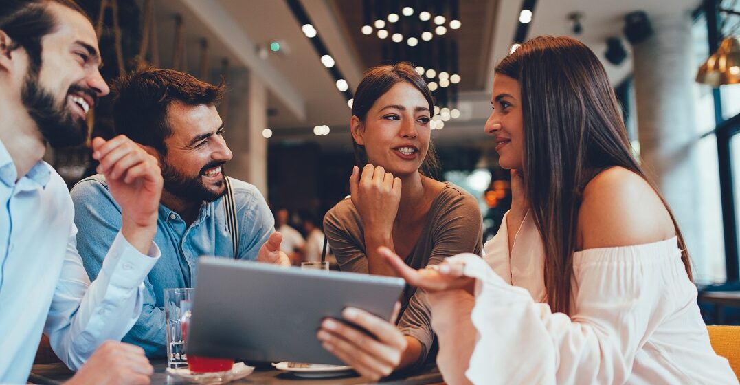 Group of friends checking out German words for complex emotions