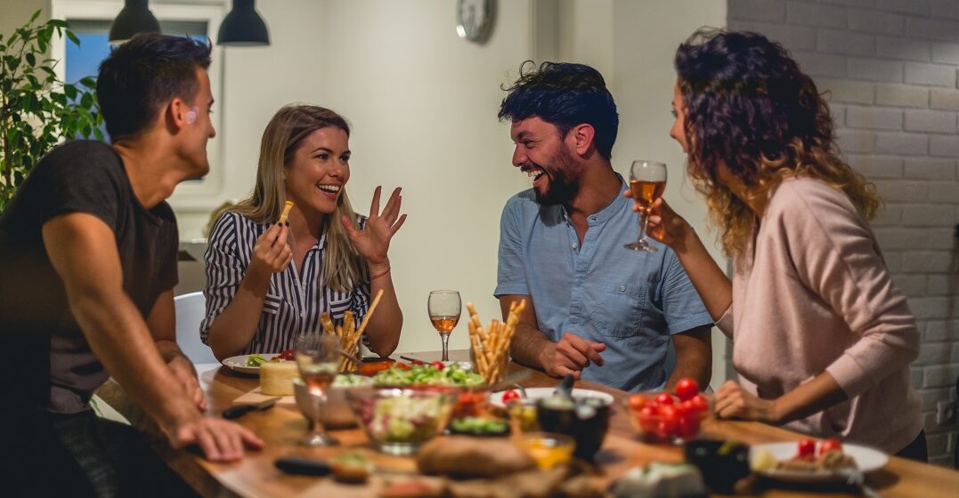 Friends having dinner, one is asking where is the bathroom in French