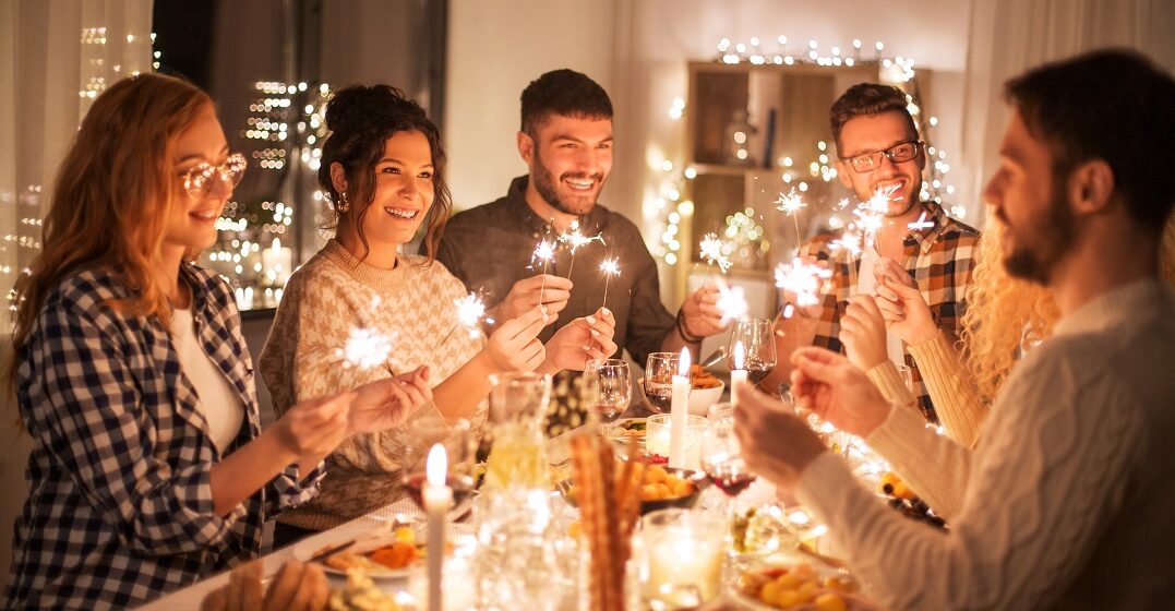 Friends celebrating and saying happy new year in French