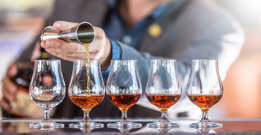 Bartender pouring a French digestif