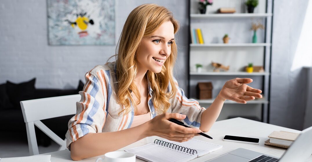 Young woman in a video call learning the German passive voice
