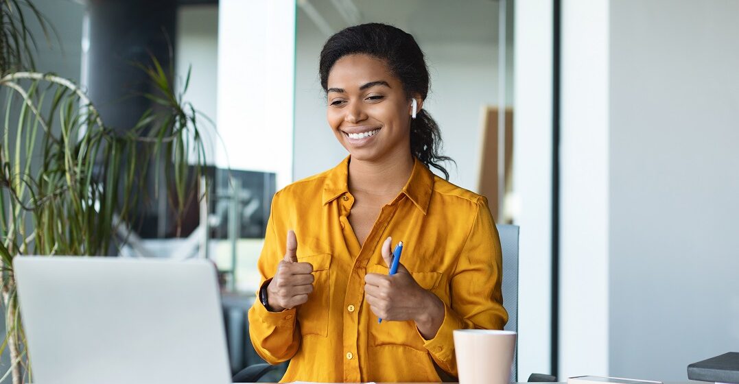 Young woman learning common gestures around the world