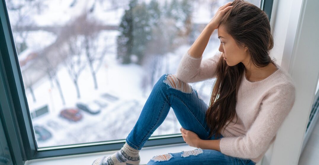 Young woman struggling with winter depression in Germany