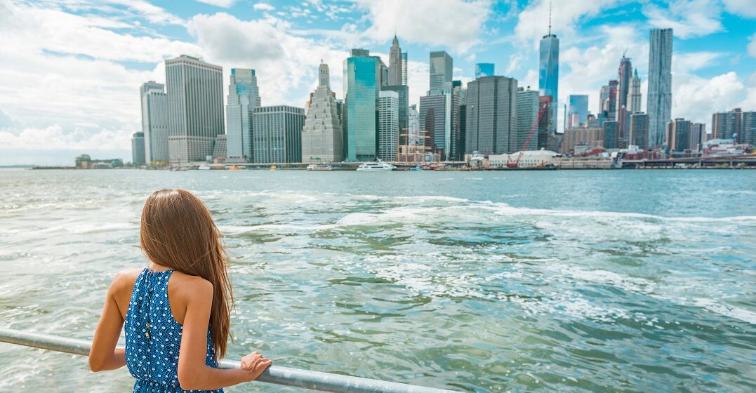 Young woman in New York wonderng what ae the differences between East coast vs West coast