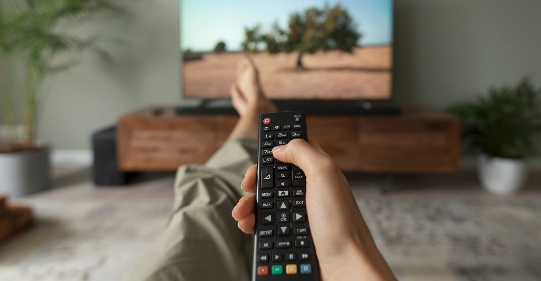 Woman watching the best French documentaries