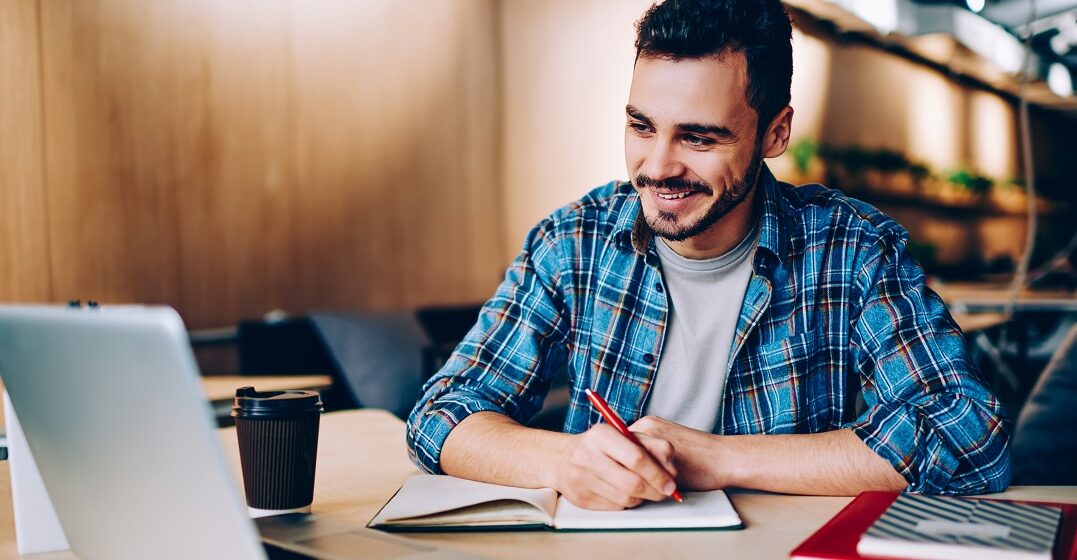 Male student learning English words used in the French language