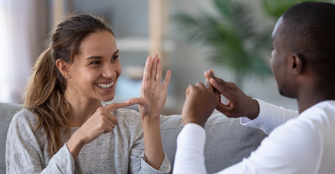 Couple speaking French sign language