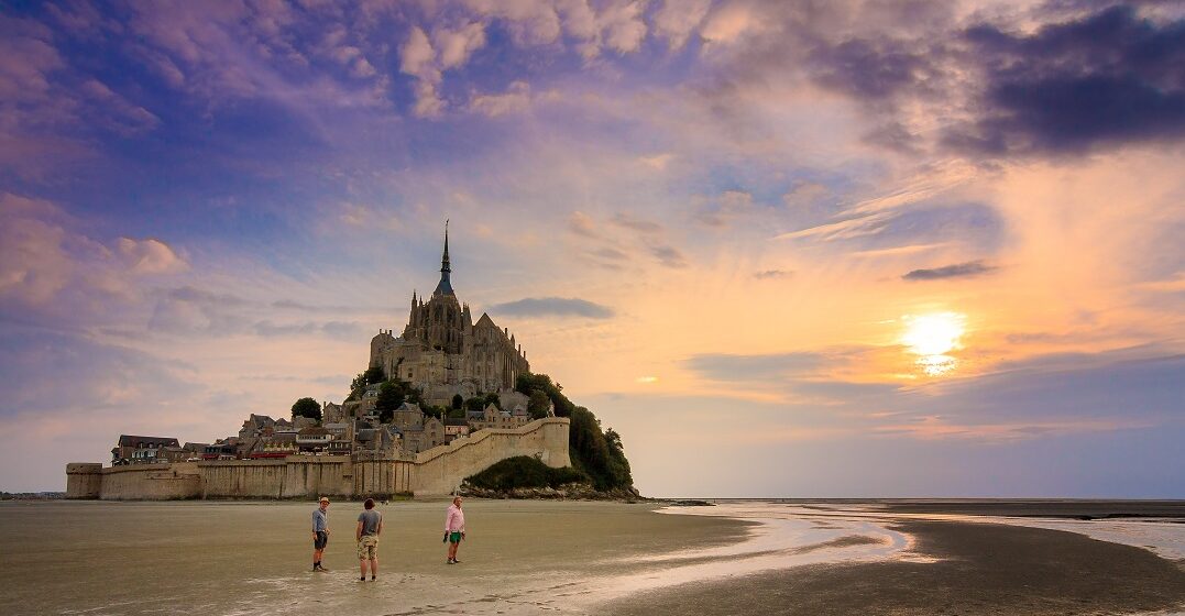 tourists at sunset in front of saint michel in one of the 13 french reagions