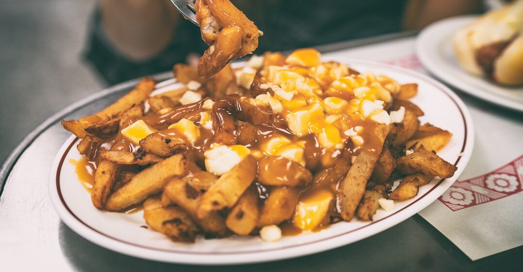 A plate of puotine, one of 8 delicious dishes from French Canadian cuisine