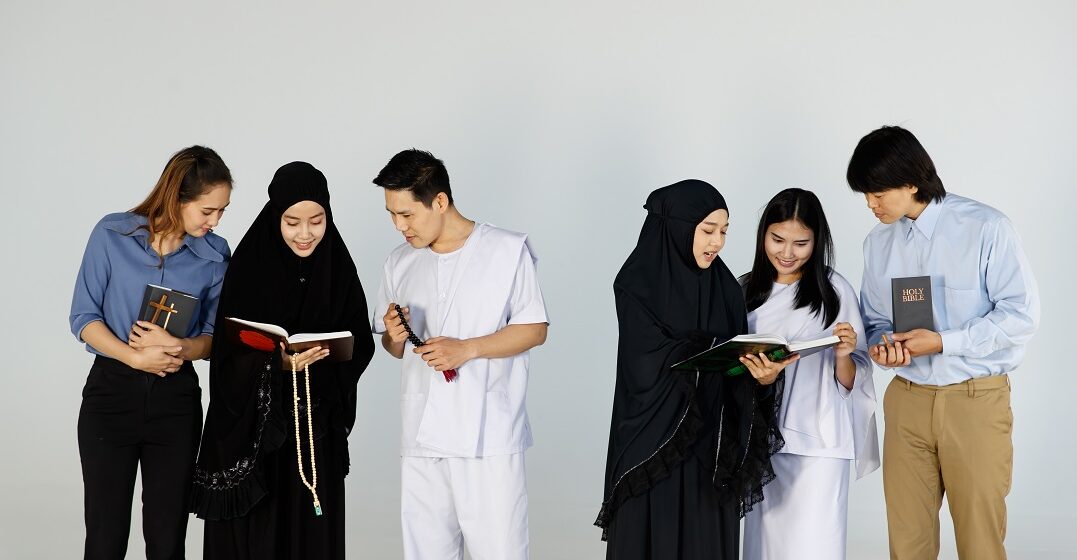 Asian,Men,And,Women,Of,Different,Religions,Have,Buddhism,muslims,,Christ. representing religion in France